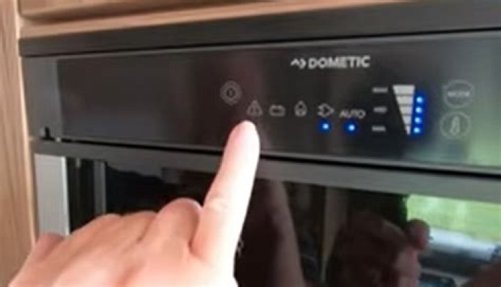 Is there a reset button on the Dometic refrigerator?
