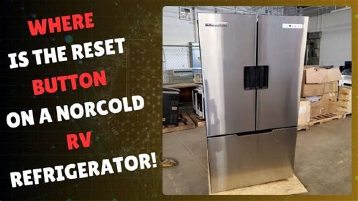 Where is the reset button on a Norcold RV fridge?